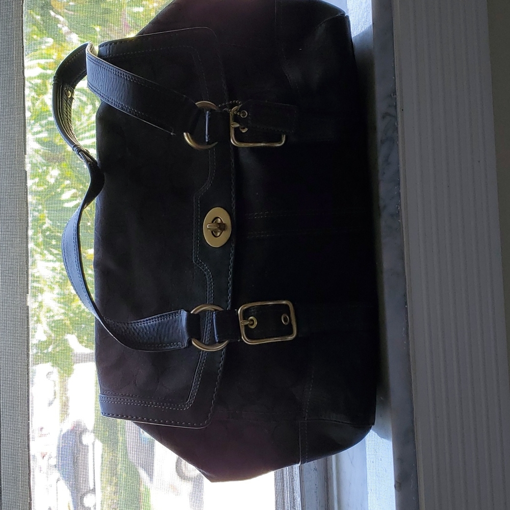 Coach insignia Large Blk shoulder bag. Very good shape. Was given as a gift.